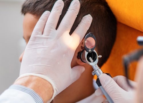 Doctor expecting a child's ear canal